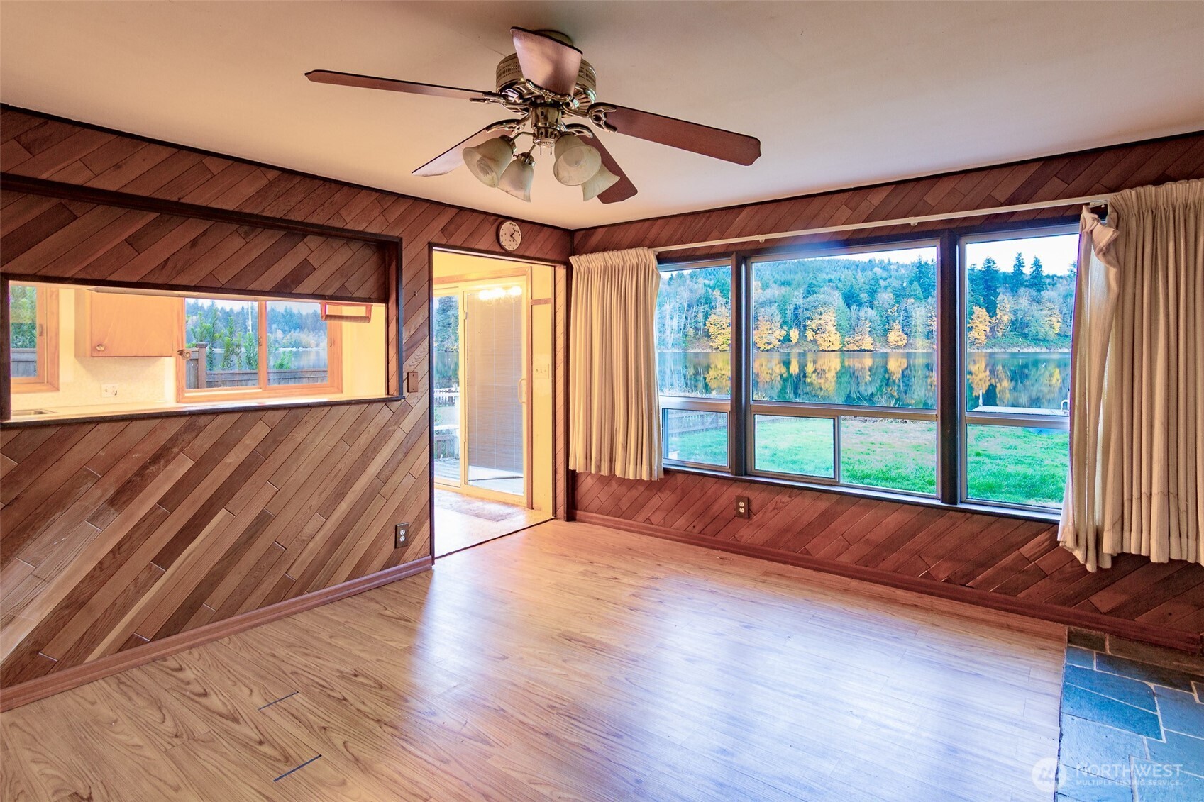 22731 Hull Road Mount Vernon, WA 98274 - Photo 5 of 26 a large room with wooden floor windows and chandelier