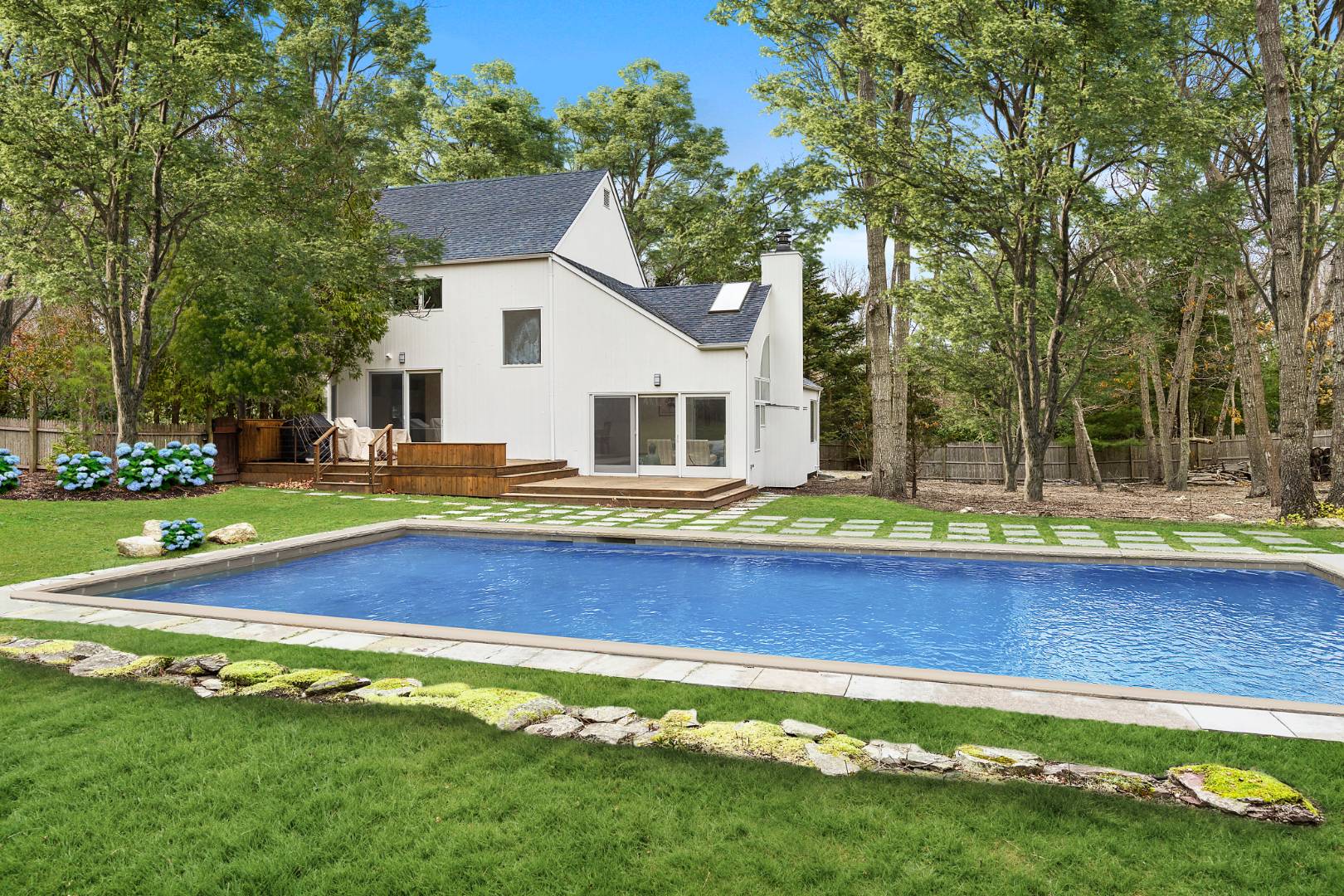 4 Fox Glove Road East Hampton, NY 11937 - Photo 1 of 15 a view of a house with swimming pool and yard