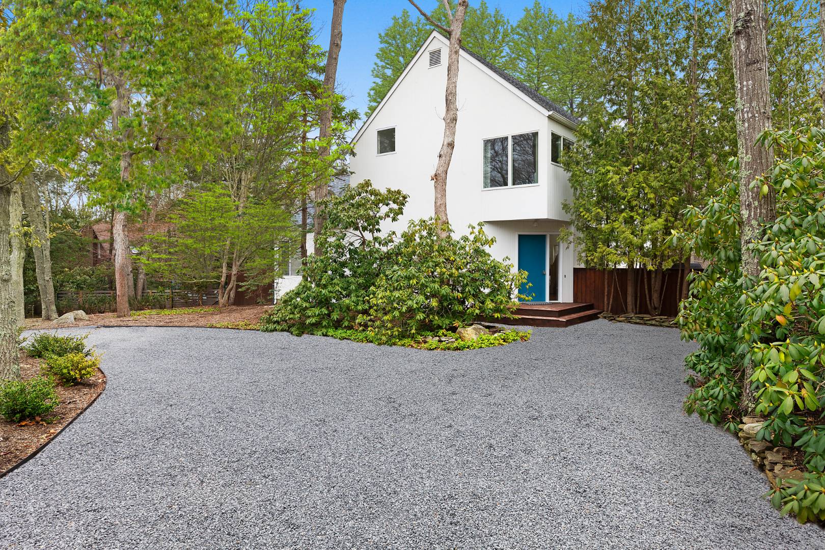 4 Fox Glove Road East Hampton, NY 11937 - Photo 2 of 15 a view of a house with backyard and garden