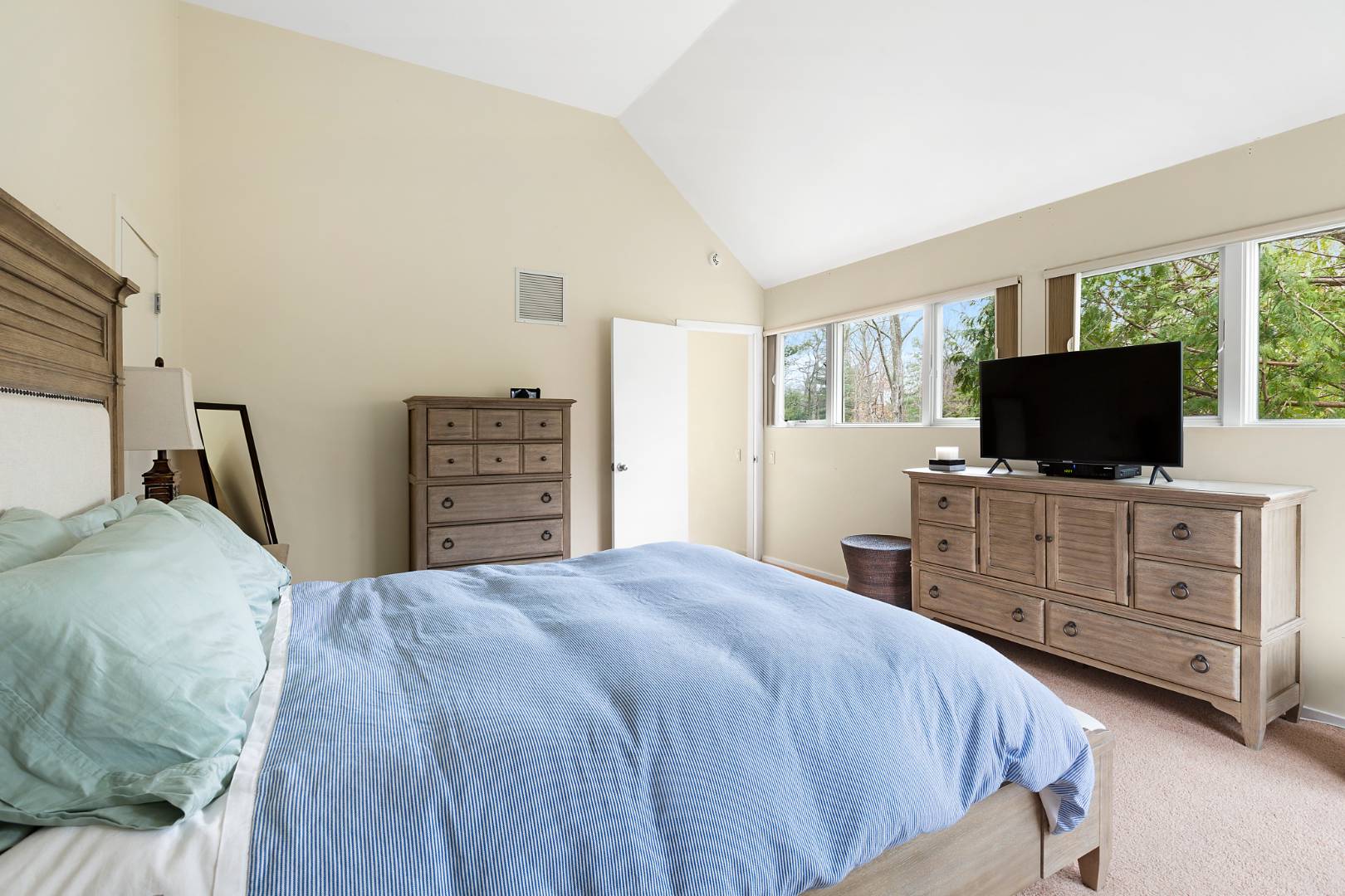 4 Fox Glove Road East Hampton, NY 11937 - Photo 13 of 15 a bedroom with a bed and flat screen tv