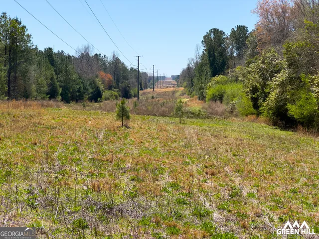 a backyard of a house with large trees