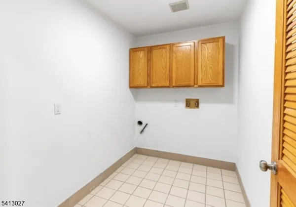 a view of an empty room and a window