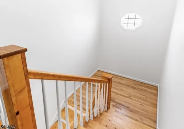 a view of a balcony with wooden floor
