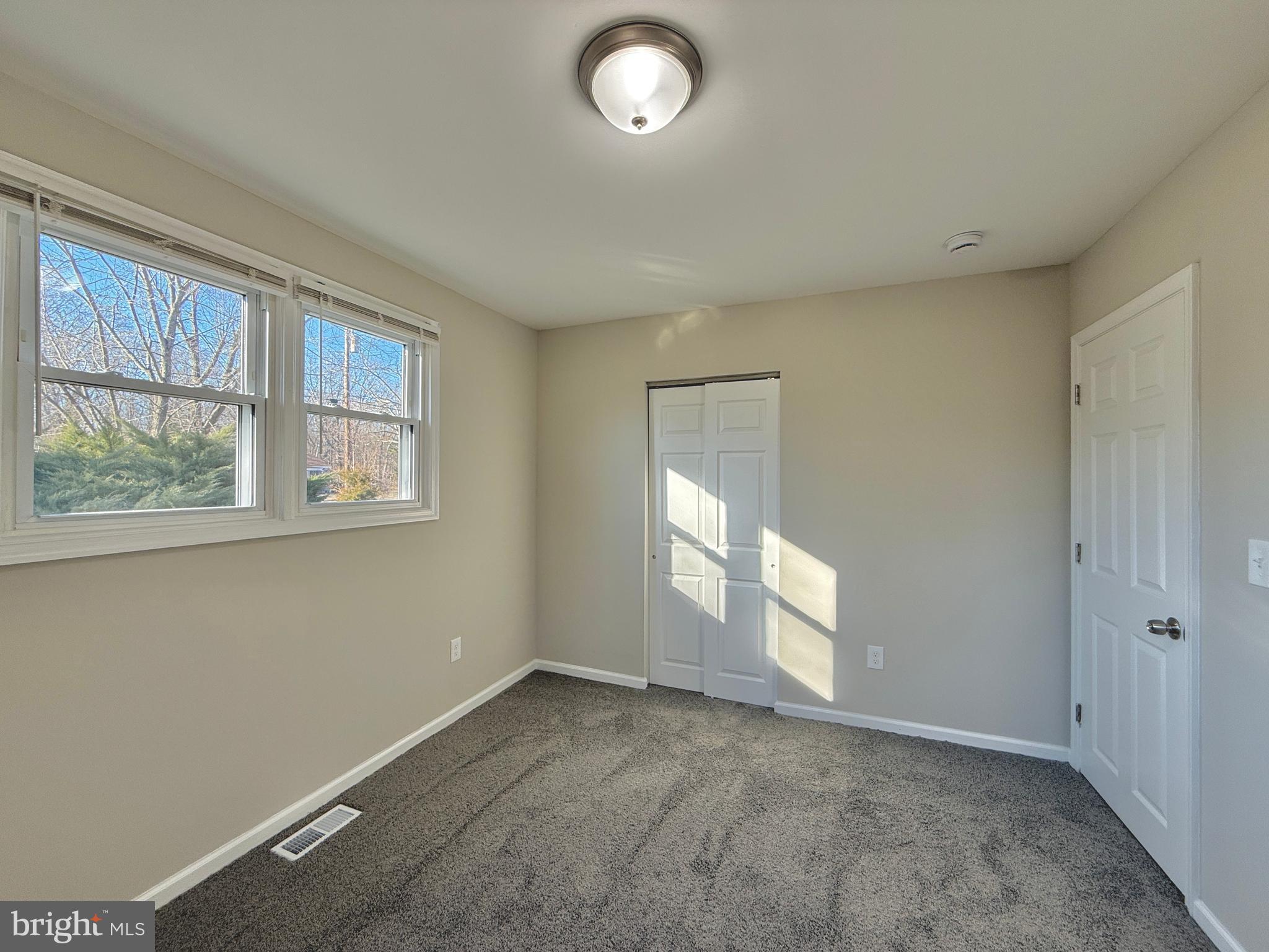 118 Colin Road Williamstown, NJ 08094 - Photo 12 of 16 wooden floor in an empty room with a window