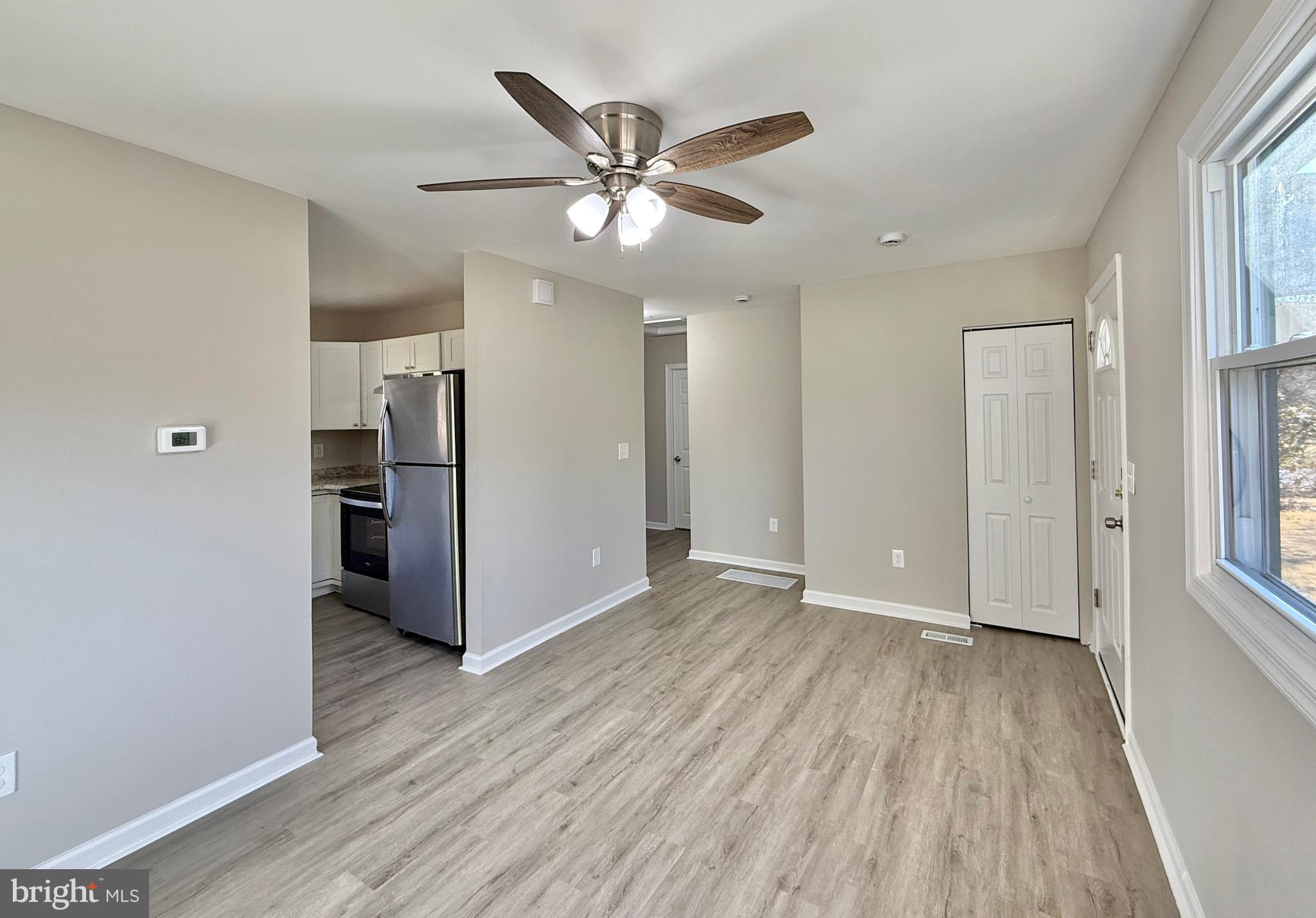 118 Colin Road Williamstown, NJ 08094 - Photo 8 of 16 a view of an empty room with wooden floor and a window