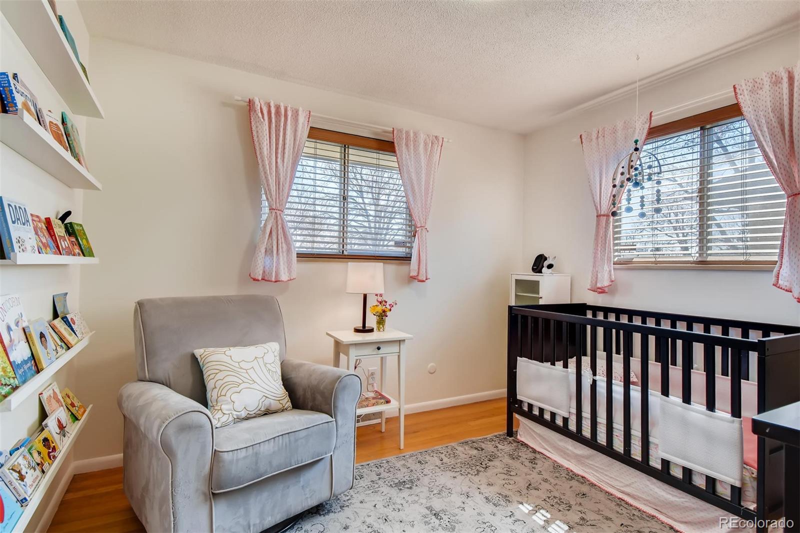 1377 South Oneida Street Denver, CO 80224 - Photo 14 of 27 a living room with furniture and a window