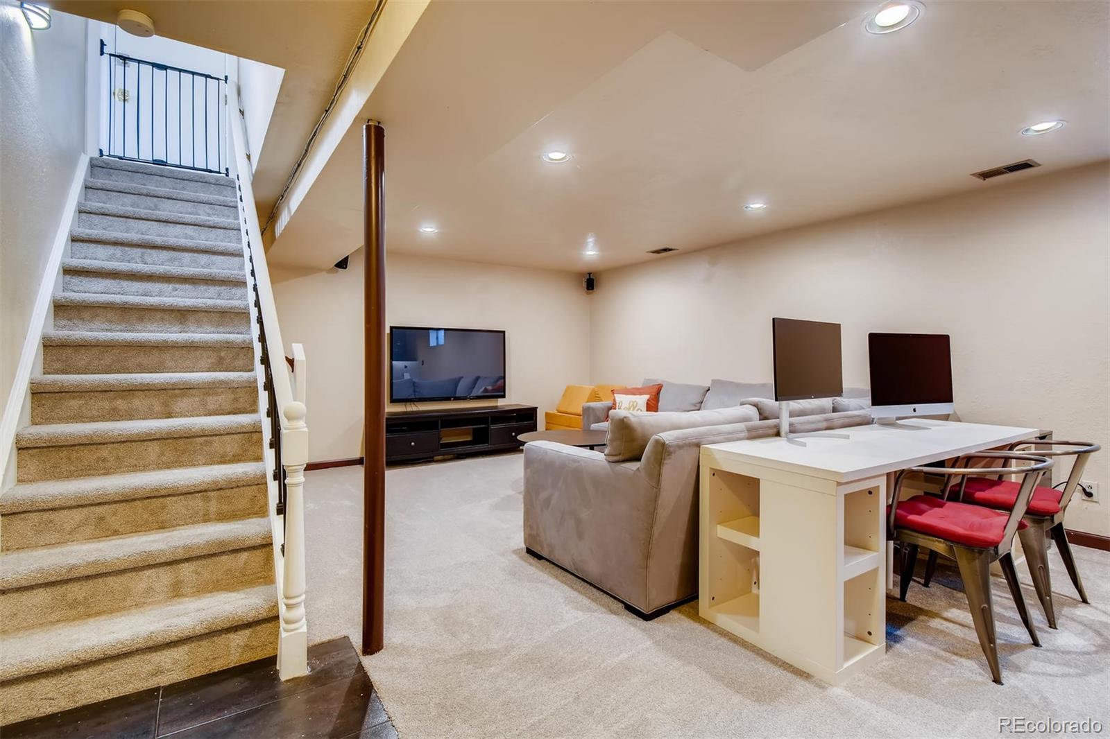 1377 South Oneida Street Denver, CO 80224 - Photo 16 of 27 a view of kitchen with cabinets and flat screen tv