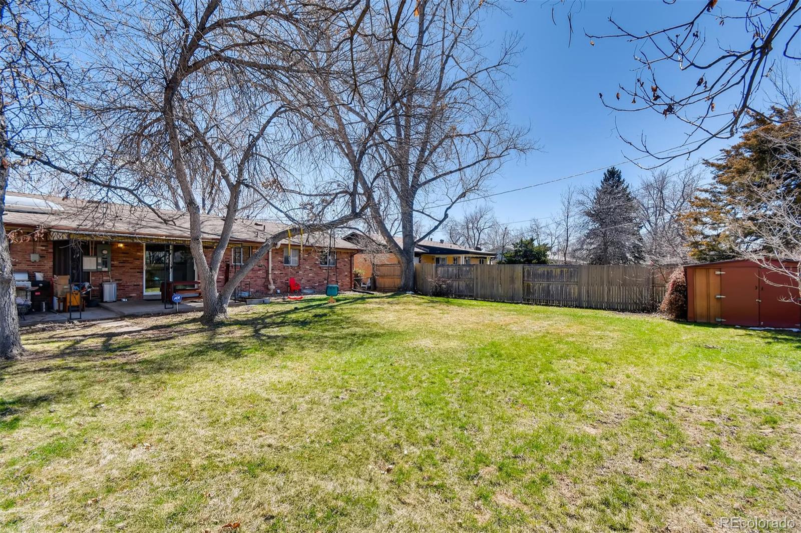 1377 South Oneida Street Denver, CO 80224 - Photo 26 of 27 a view of swimming pool with garden and trees