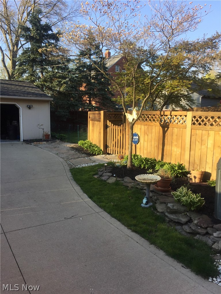 3433 Bradford Road Cleveland, OH 44118 - Photo 3 of 35 Wood privacy fencing w/ gate, allows for a fully fenced in courtyard & charming garden.