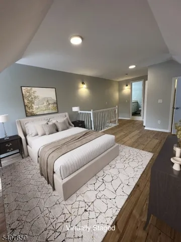 a bedroom with a large bed and a walk in closet