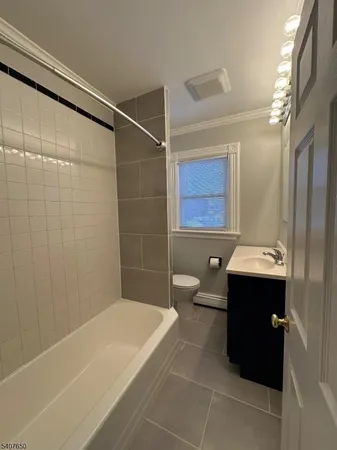 a bathroom with a bathtub and sink