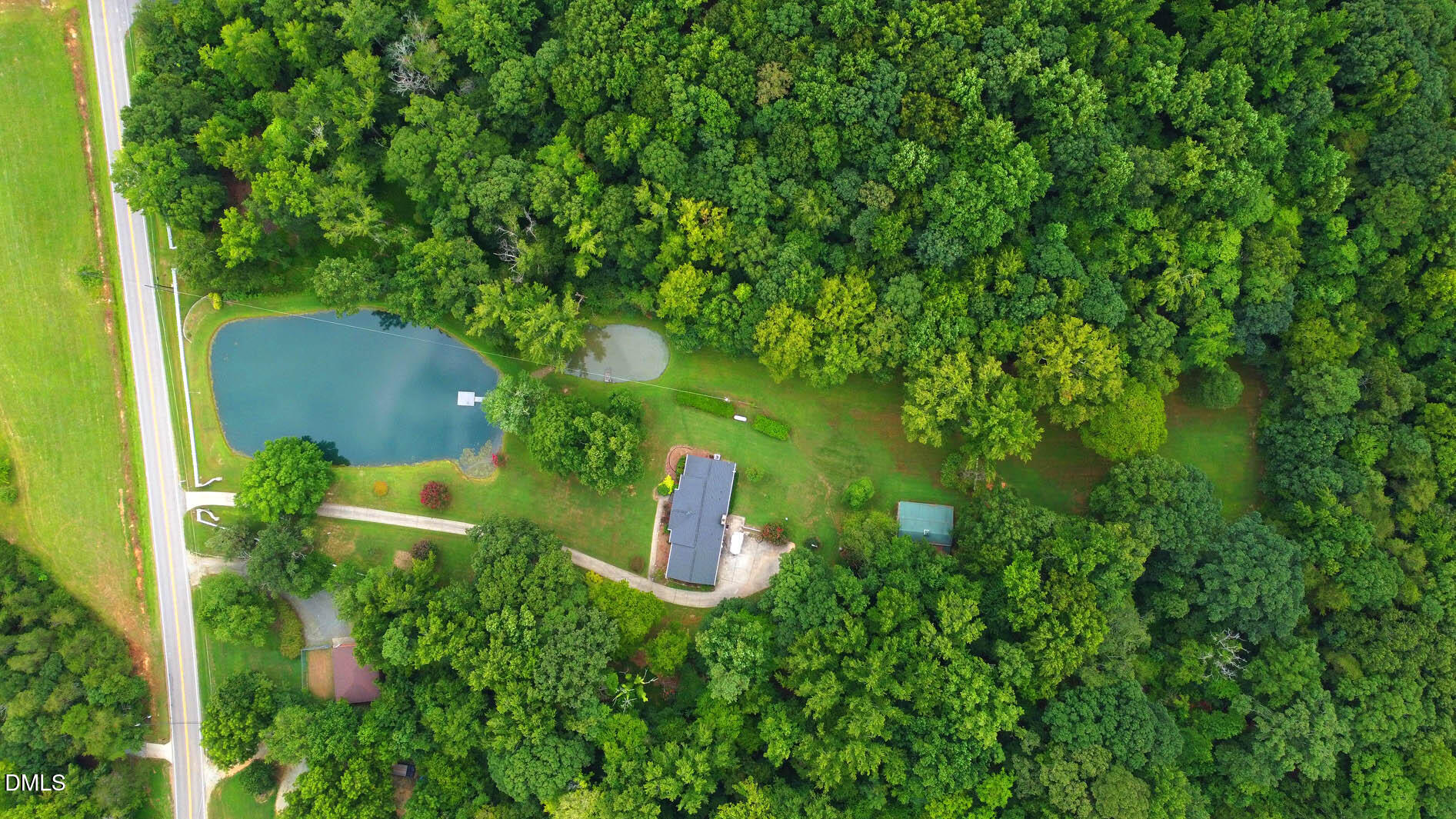 8509 Stagville Road Bahama, NC 27503 - Photo 16 of 95 an aerial view of a house with a yard and trees