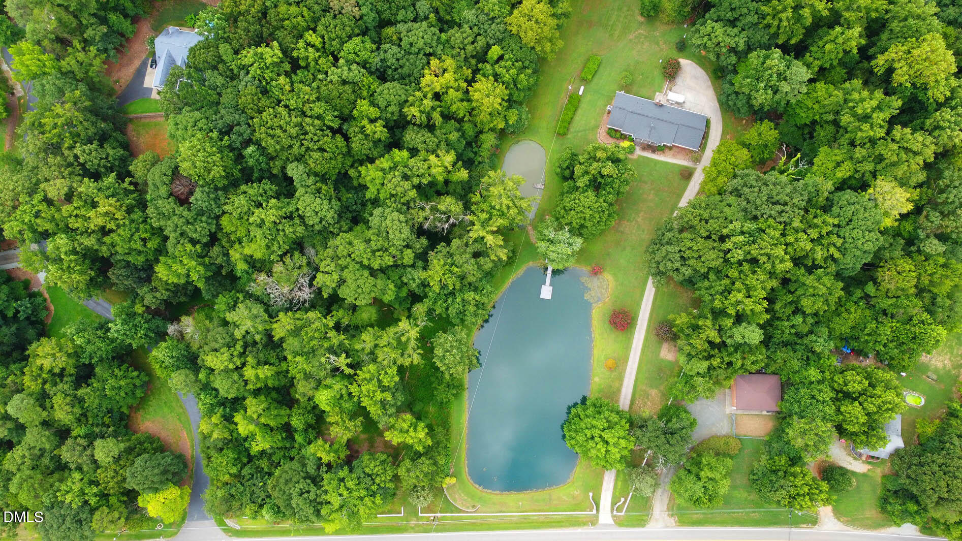 8509 Stagville Road Bahama, NC 27503 - Photo 17 of 95 an aerial view of residential house with outdoor space and trees all around