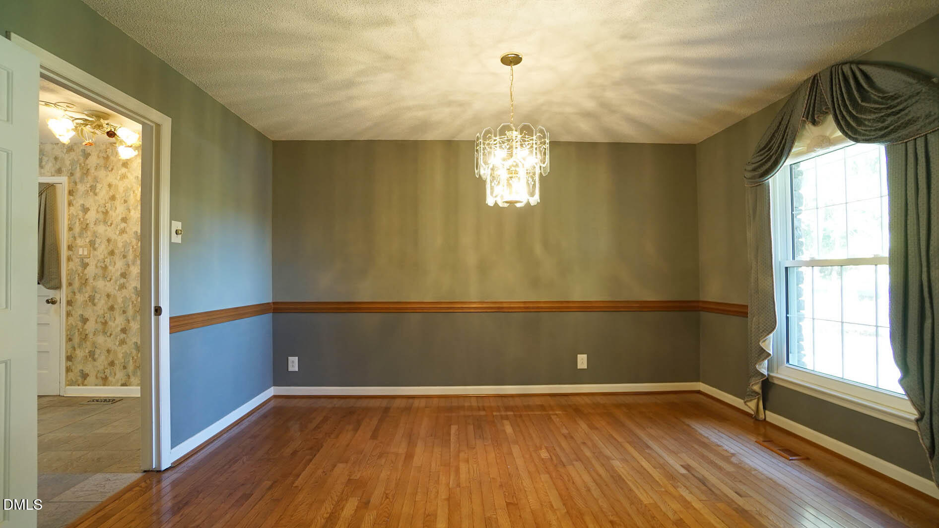 8509 Stagville Road Bahama, NC 27503 - Photo 41 of 95 a view of empty room with wooden floor and fan
