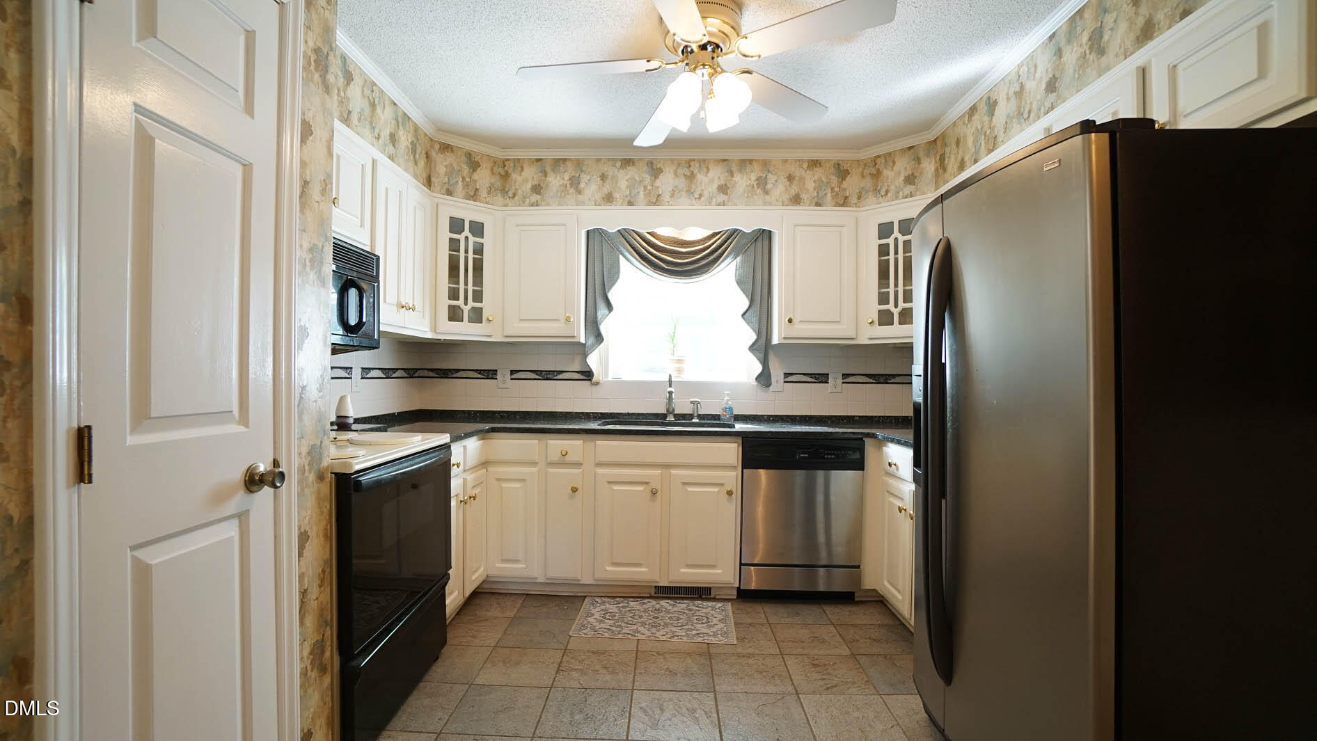 8509 Stagville Road Bahama, NC 27503 - Photo 46 of 95 a kitchen with stainless steel appliances granite countertop a refrigerator and a sink