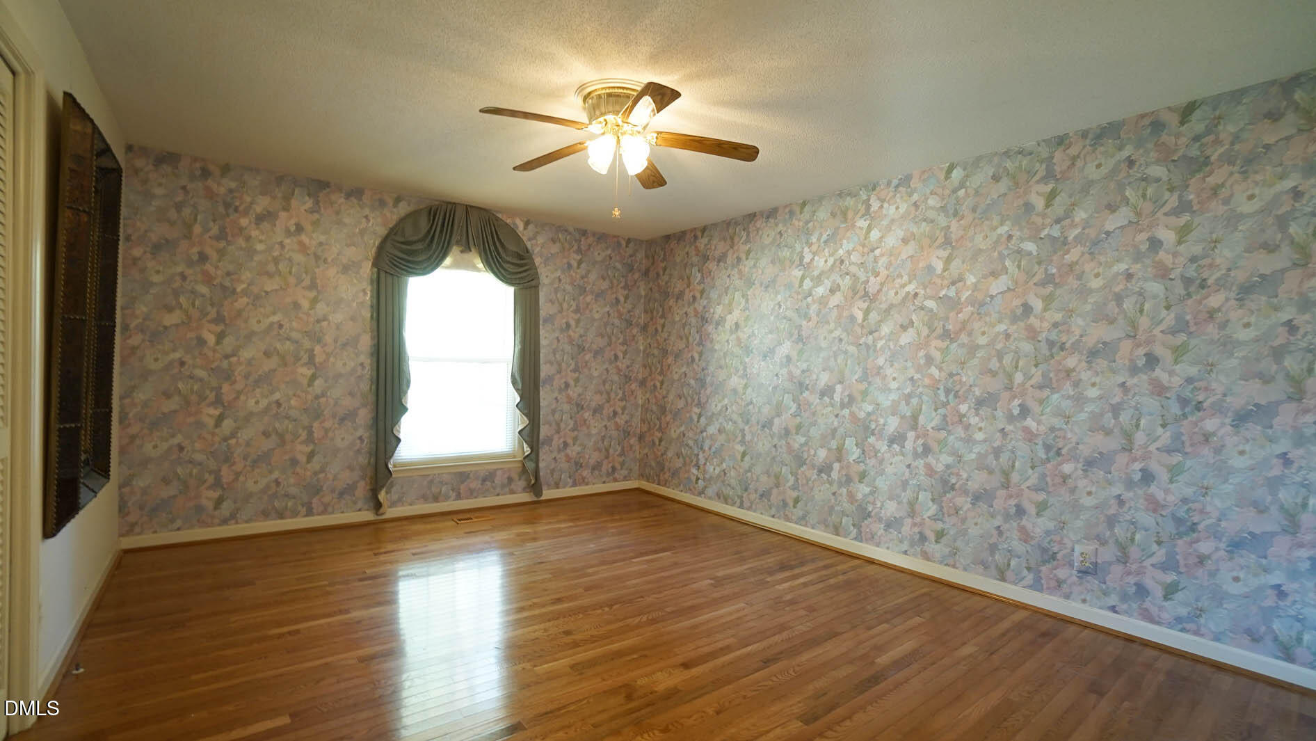8509 Stagville Road Bahama, NC 27503 - Photo 56 of 95 wooden floor in an empty room with a window