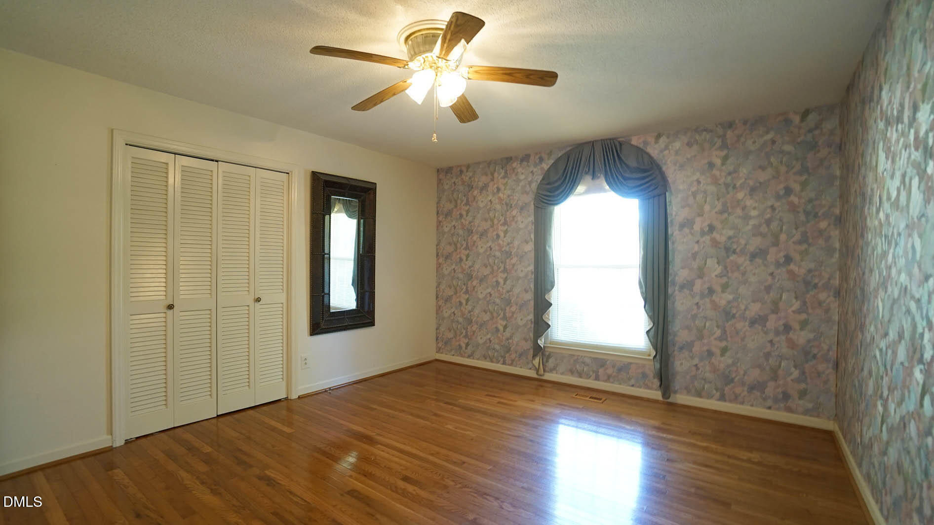 8509 Stagville Road Bahama, NC 27503 - Photo 57 of 95 a view of empty room with wooden floor and fan