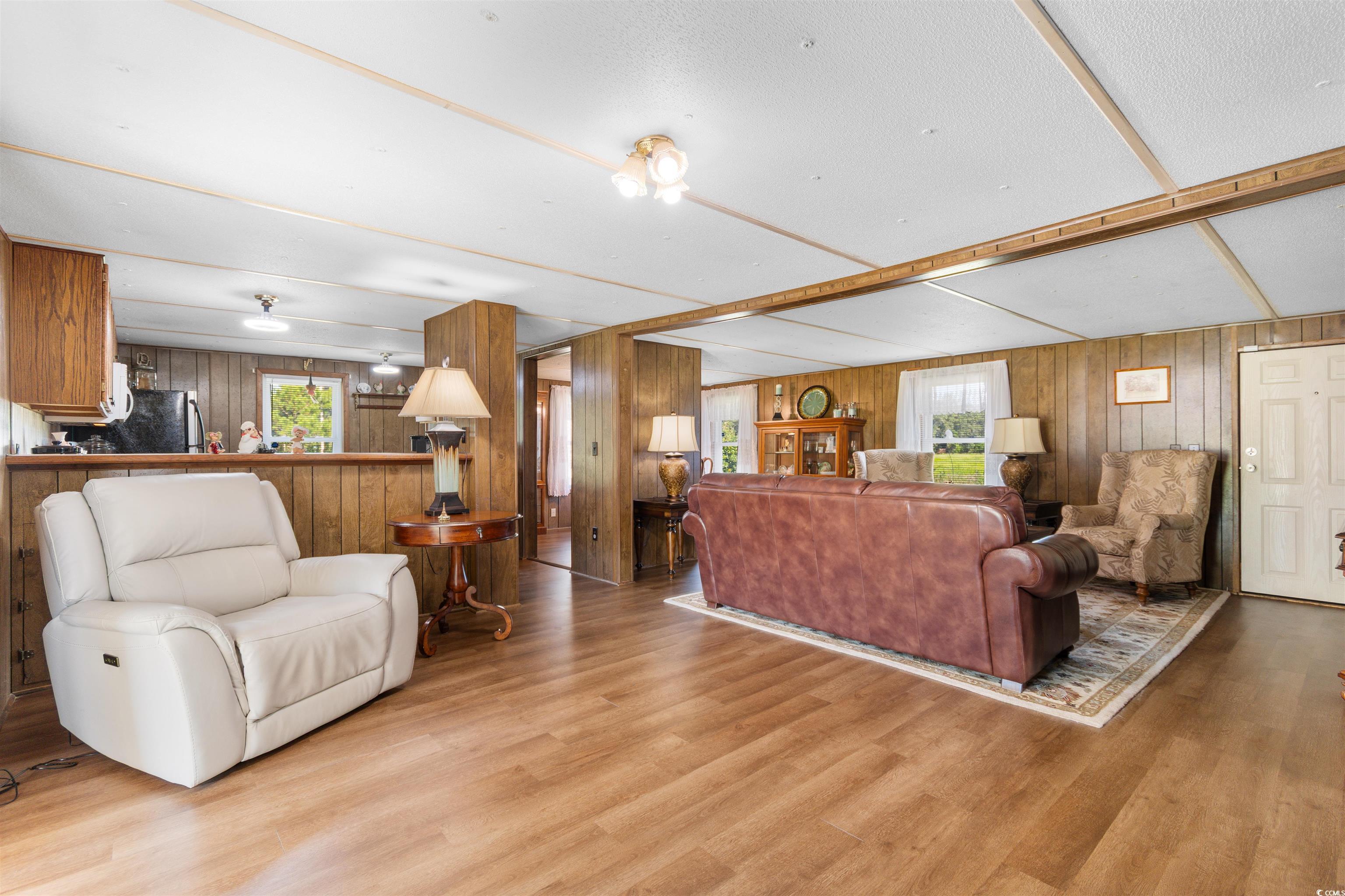 299 Williams Hill Road Hemingway, SC 29554 - Photo 16 of 40 Living room with wood walls and wood finished floors