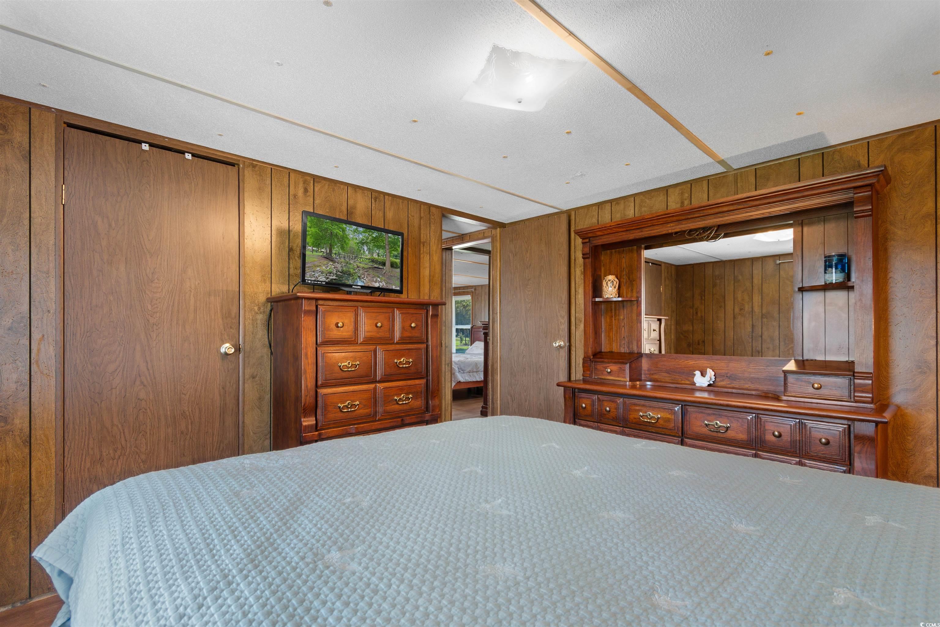 299 Williams Hill Road Hemingway, SC 29554 - Photo 20 of 40 Bedroom featuring wood walls and a closet