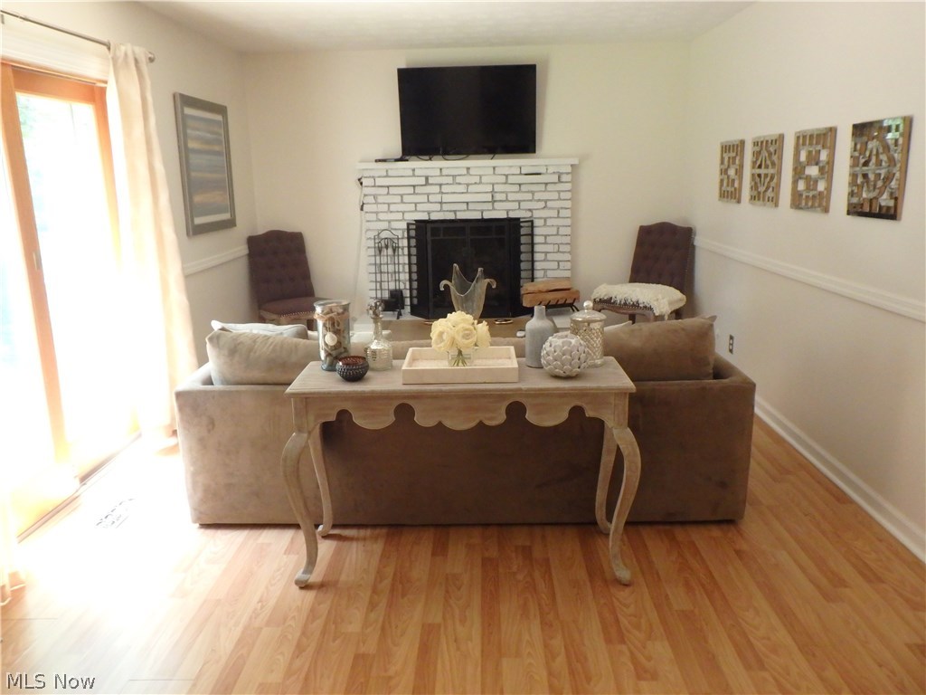 2546 Durand Road Fairlawn, OH 44333 - Photo 7 of 17 The family room offers the fireplace, patio door and to the right is the garage access