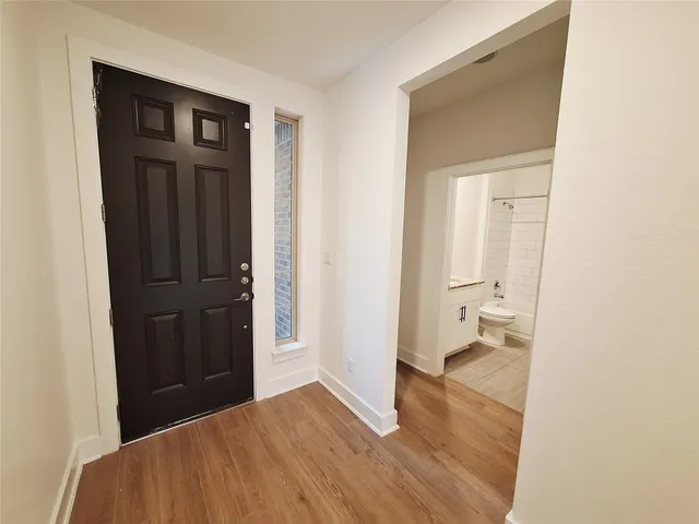 a view of a bedroom from a hallway