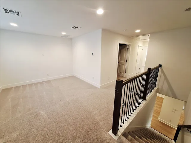 an empty room with staircase