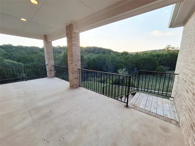 a view of balcony with yard