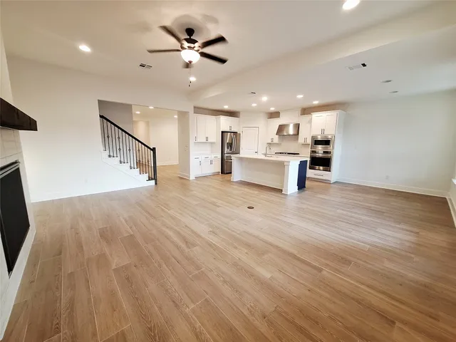 a view of kitchen with cabinets and wooden floor