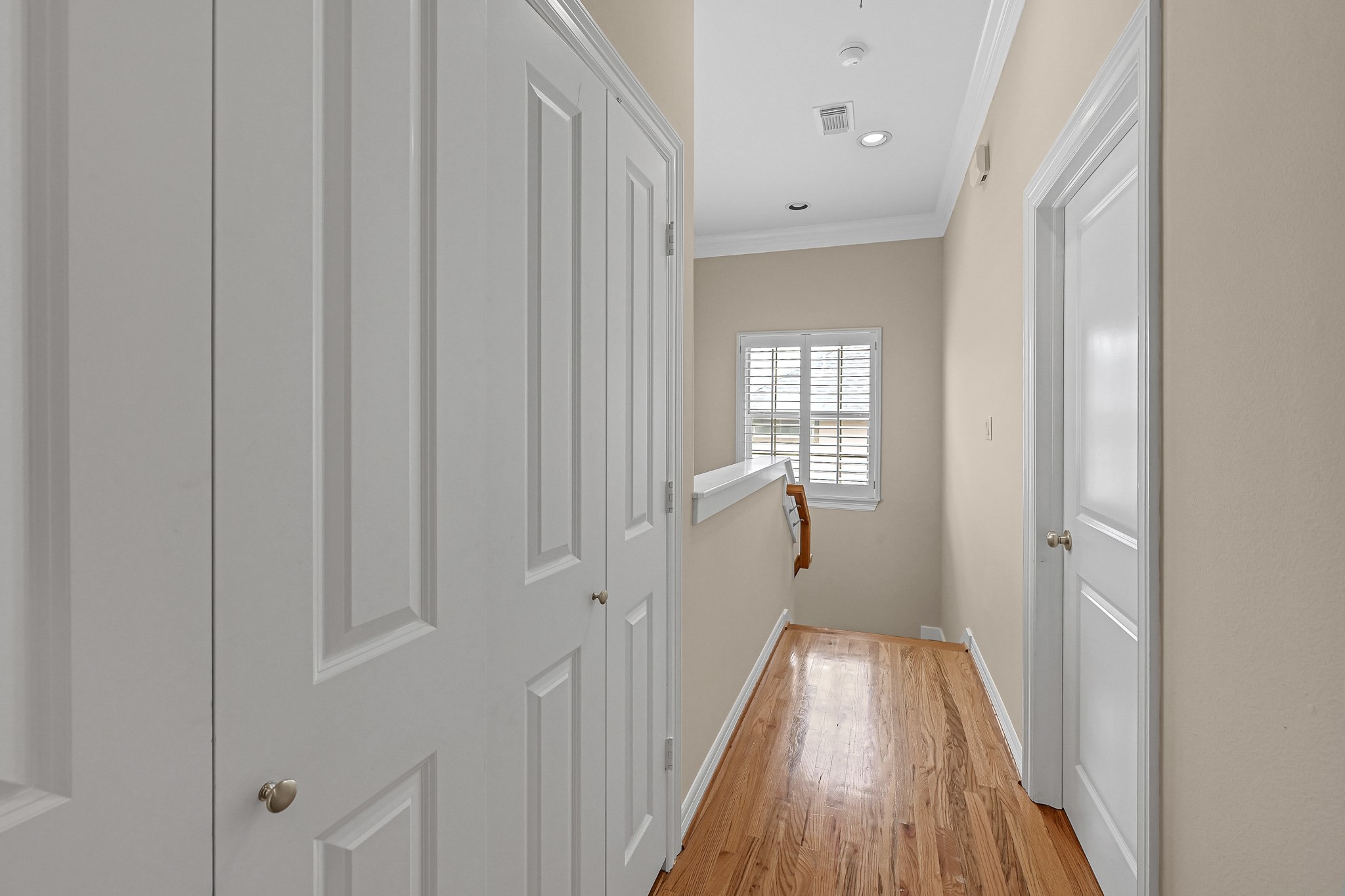1204 Cohn Street Houston, TX 77007 - Photo 17 of 25 a view of a hallway with wooden floor and a bathroom