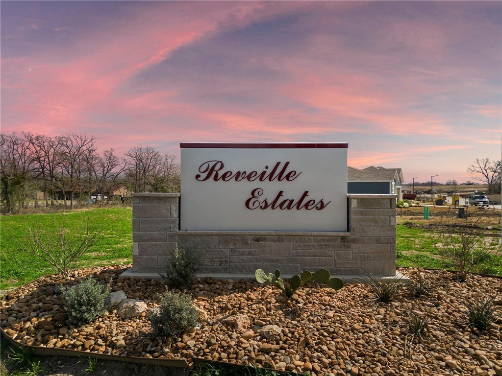 1700 Blocker Court Bryan, TX 77845 - Photo 6 of 8 a sign that is sitting in the middle of a field