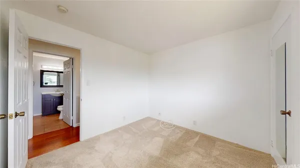 a view of a room that has a bed