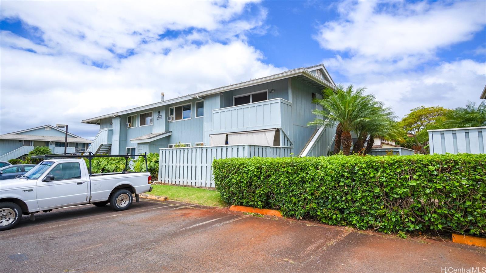 94-1036 Paha Place, Unit R8 Waipahu, HI 96797 - Photo 19 of 23 a car parked in front of a house