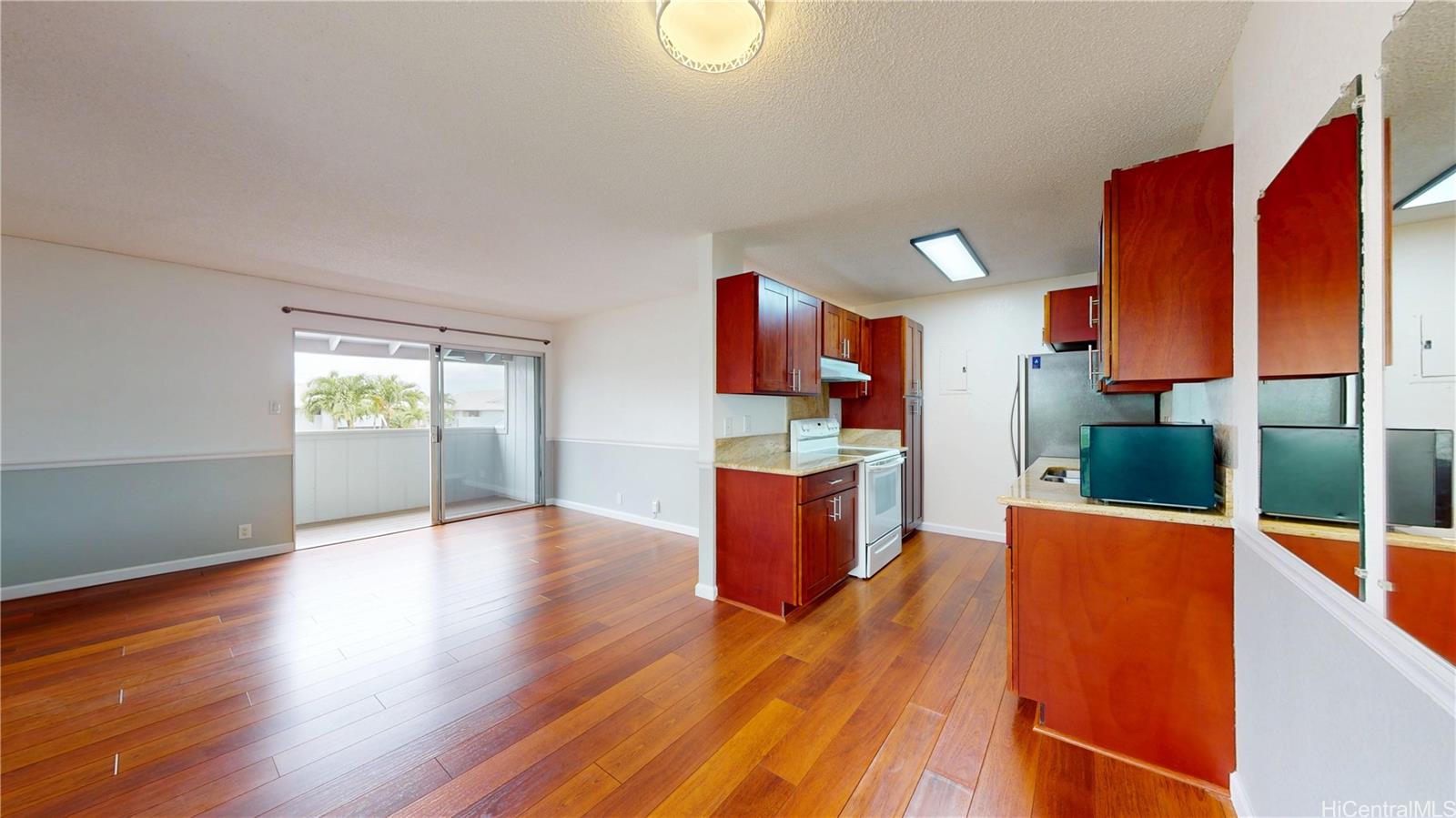 94-1036 Paha Place, Unit R8 Waipahu, HI 96797 - Photo 3 of 23 a view of kitchen and hall with wooden floor