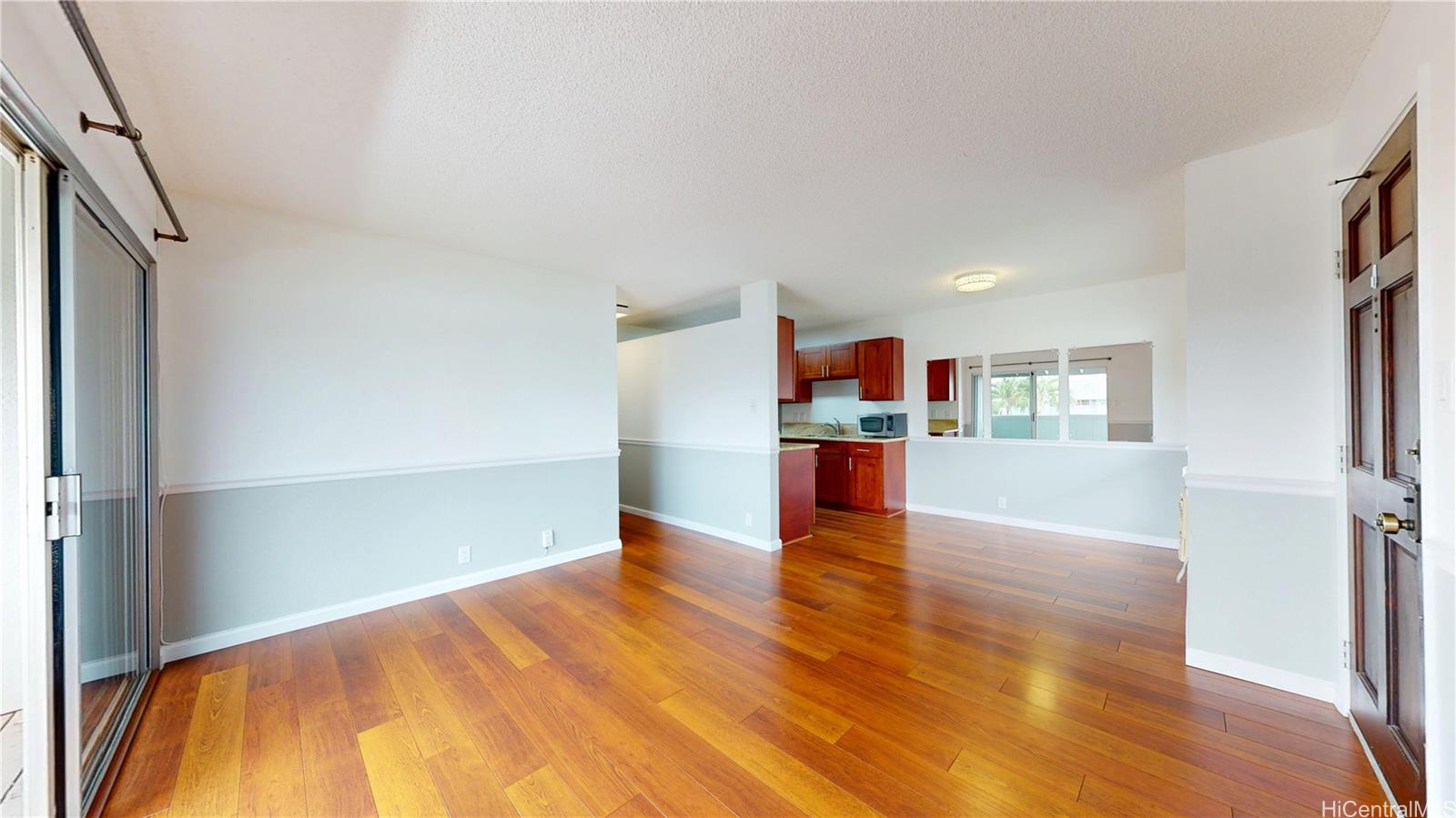 94-1036 Paha Place, Unit R8 Waipahu, HI 96797 - Photo 5 of 23 a view of empty room with wooden floor