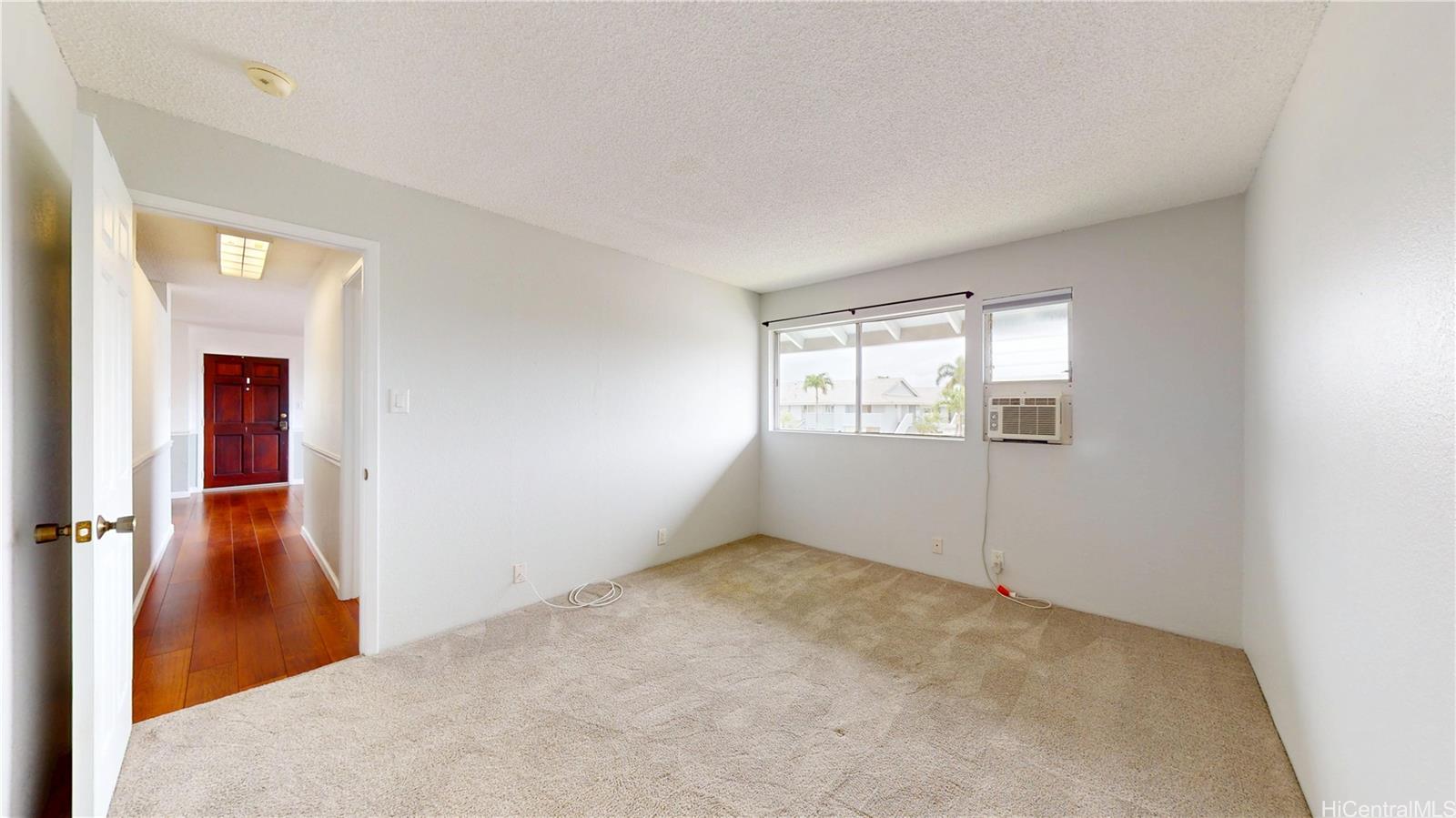 94-1036 Paha Place, Unit R8 Waipahu, HI 96797 - Photo 8 of 23 an empty room with windows