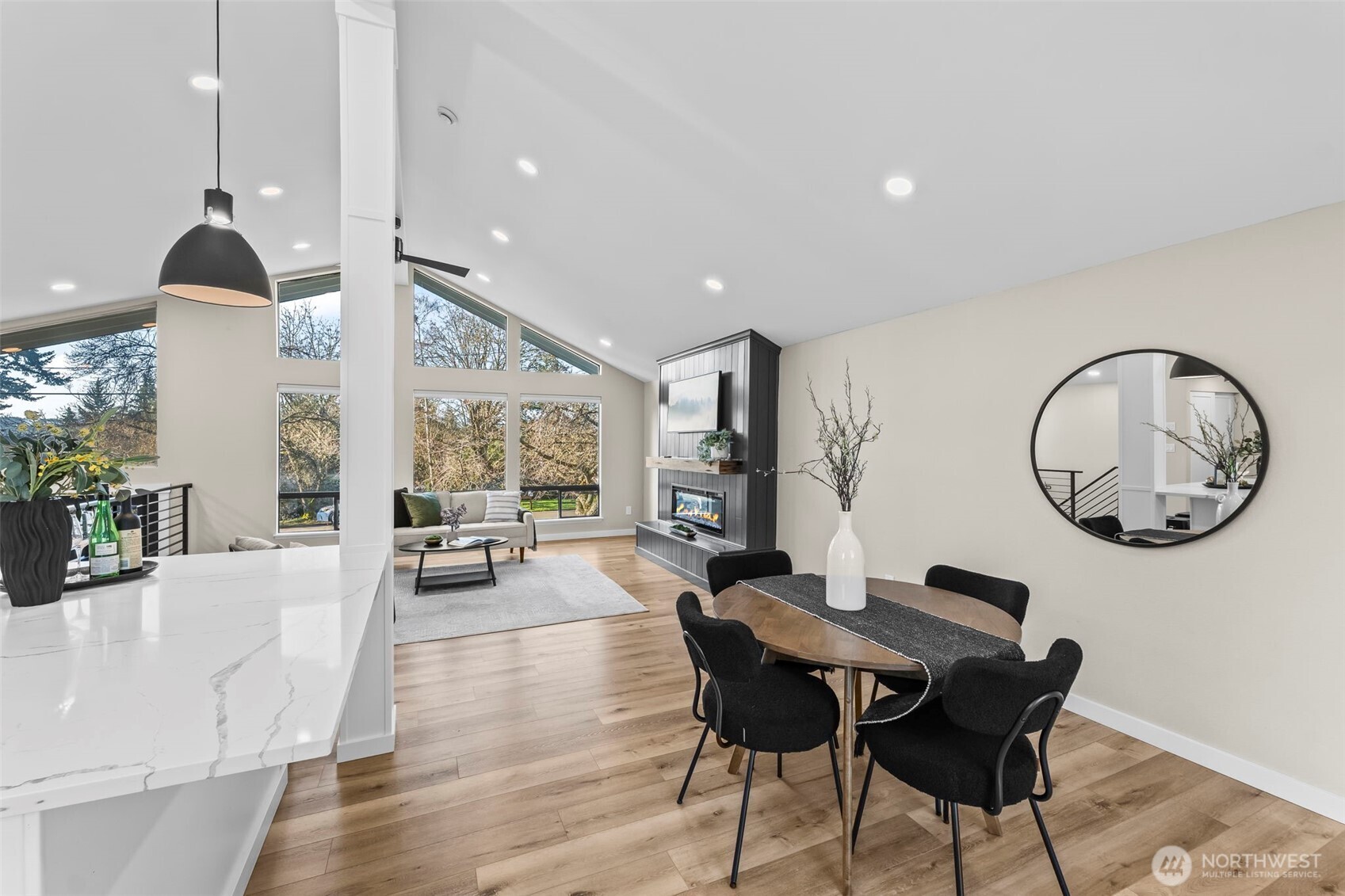 9844 Olson Road Northwest Silverdale, WA 98383 - Photo 11 of 38 a view of a dining room with furniture window and wooden floor