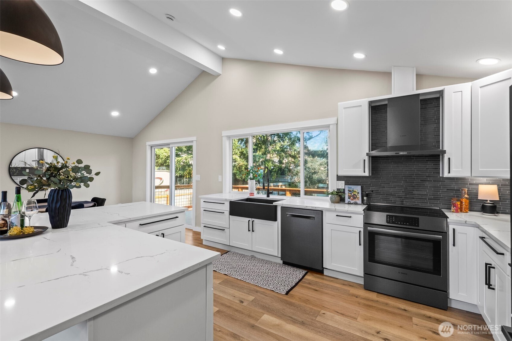 9844 Olson Road Northwest Silverdale, WA 98383 - Photo 15 of 38 a kitchen with a sink stove and microwave