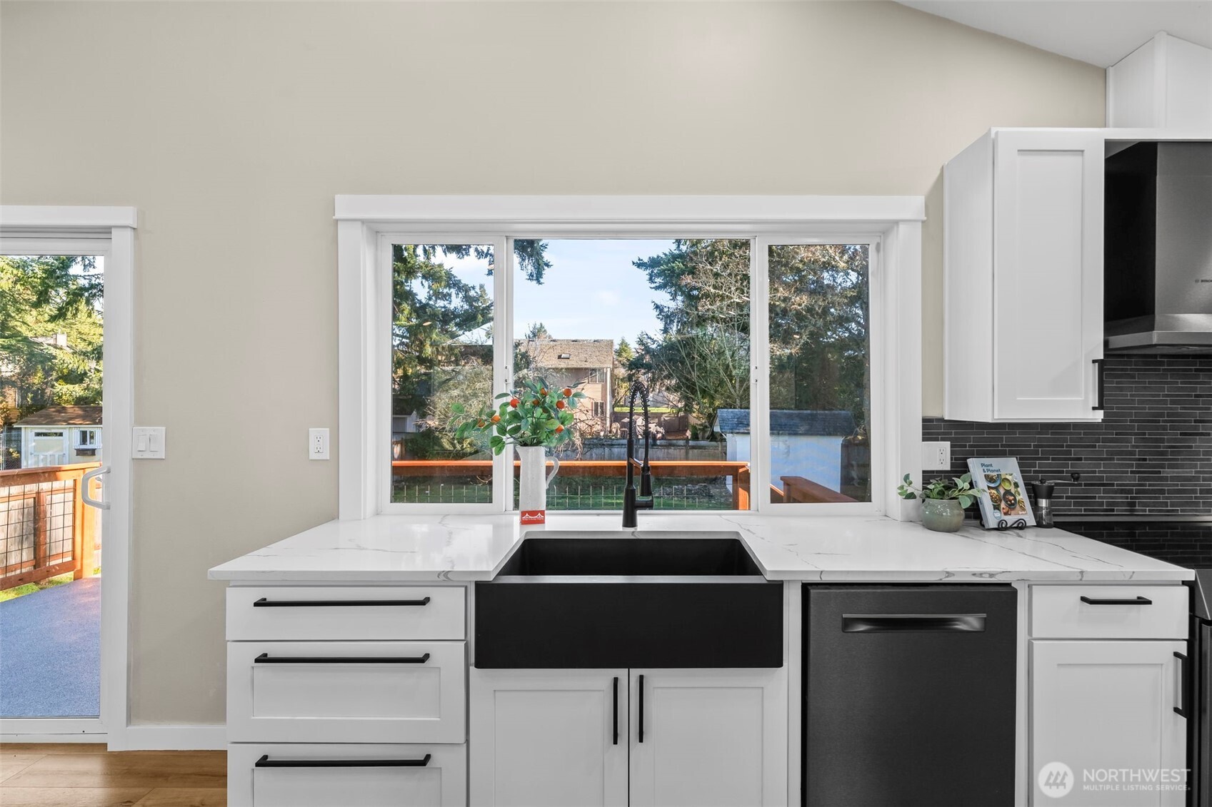 9844 Olson Road Northwest Silverdale, WA 98383 - Photo 16 of 38 a kitchen with a sink and a large window
