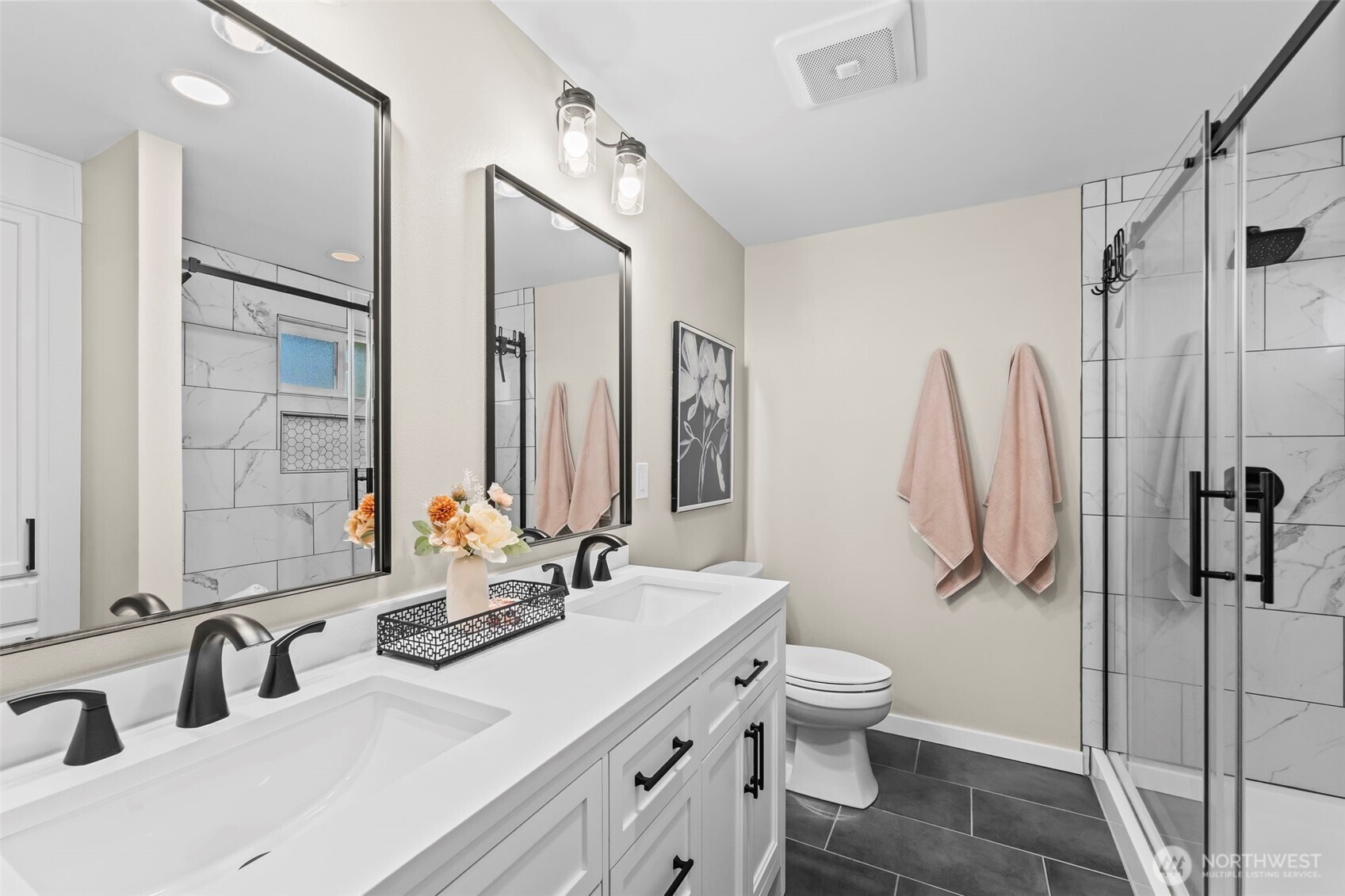 9844 Olson Road Northwest Silverdale, WA 98383 - Photo 21 of 38 a bathroom with a double vanity sink mirror and toilet