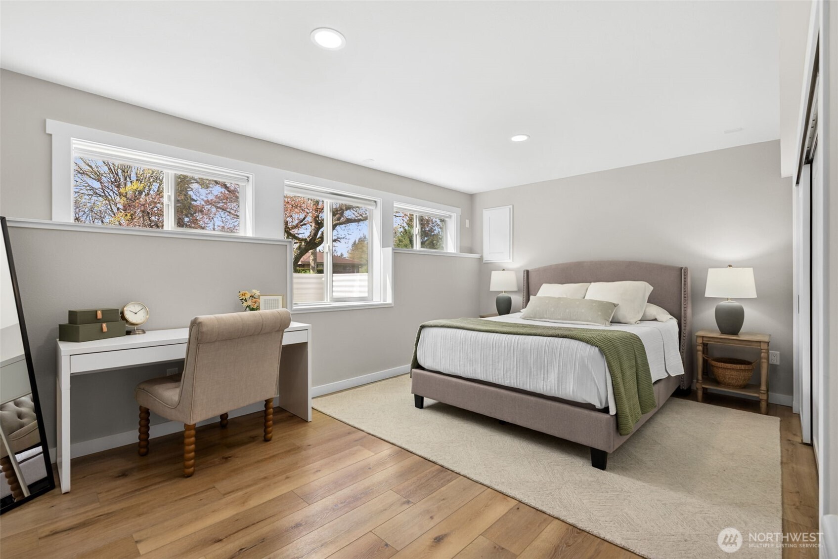 9844 Olson Road Northwest Silverdale, WA 98383 - Photo 28 of 38 a bedroom with a large bed and a desk