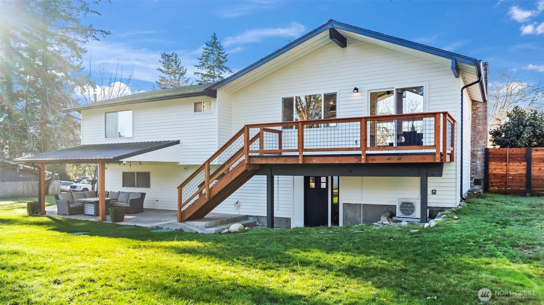 9844 Olson Road Northwest Silverdale, WA 98383 - Photo 32 of 38 a view of a house with a swimming pool and a yard