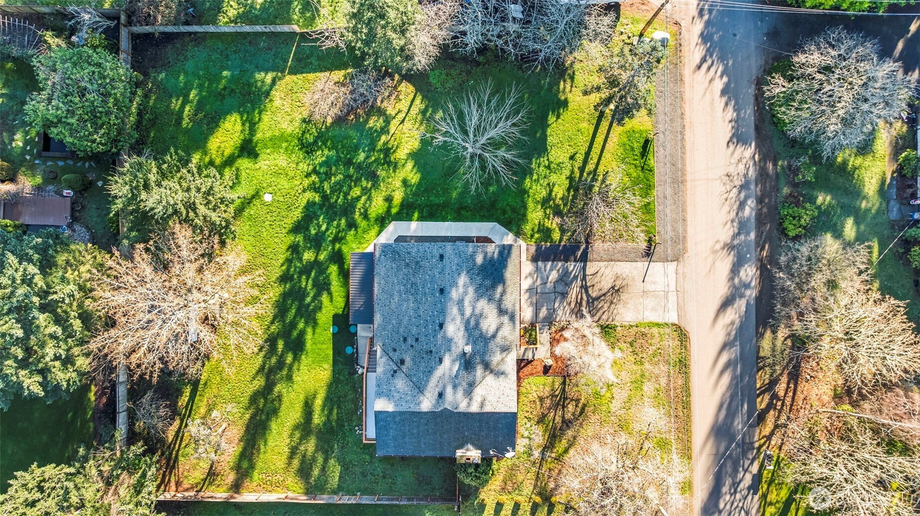 9844 Olson Road Northwest Silverdale, WA 98383 - Photo 37 of 38 a view of swimming pool with a garden