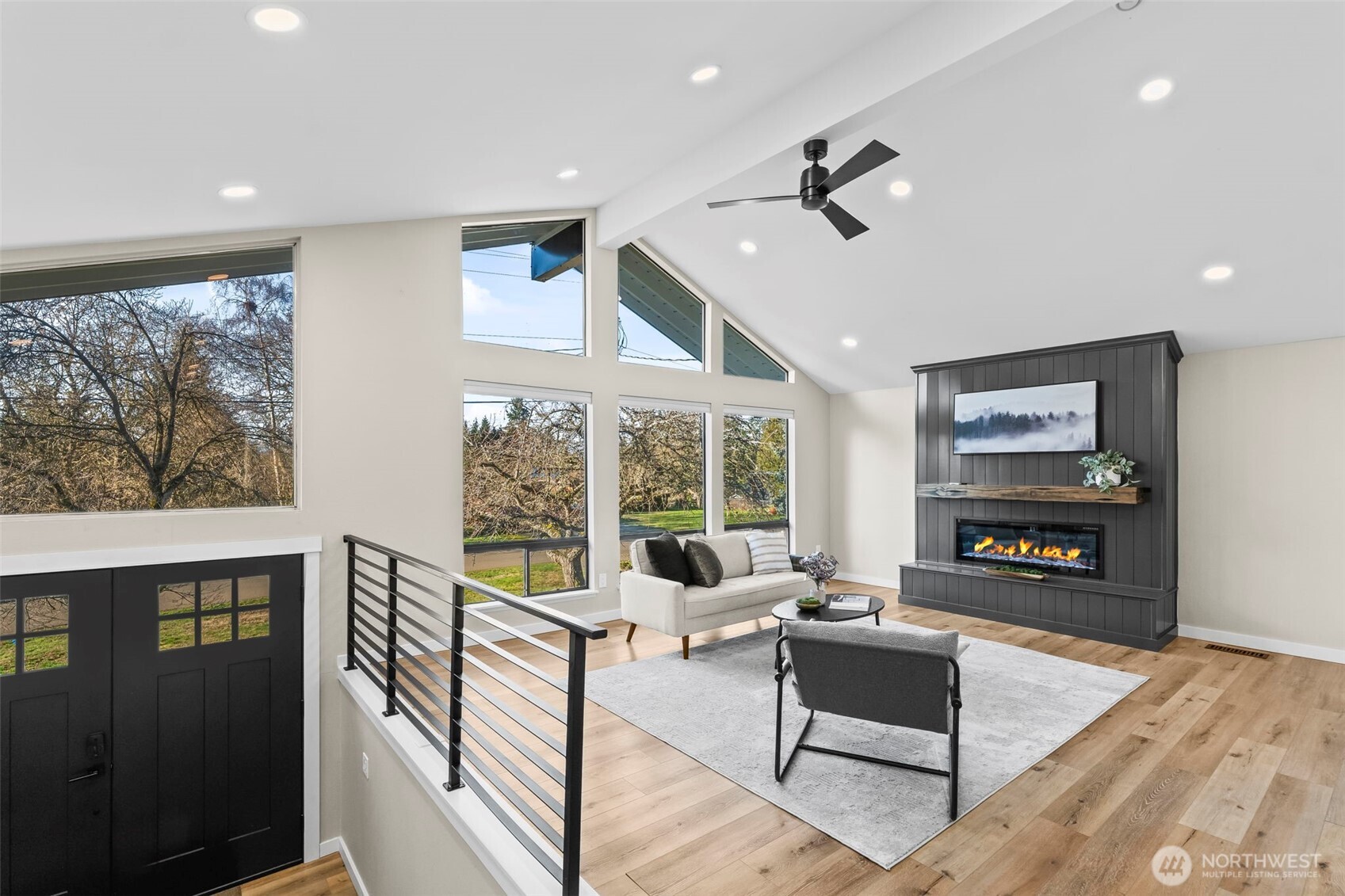 9844 Olson Road Northwest Silverdale, WA 98383 - Photo 5 of 38 a living room with furniture large window and flat screen tv