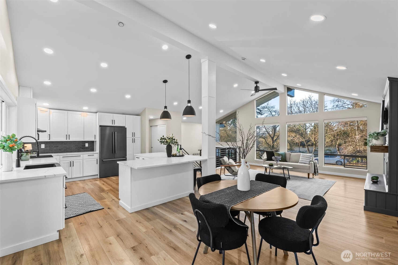 9844 Olson Road Northwest Silverdale, WA 98383 - Photo 9 of 38 a large kitchen with a table and chairs in it