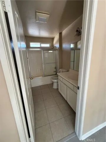 a bathroom with a double vanity sink and mirror
