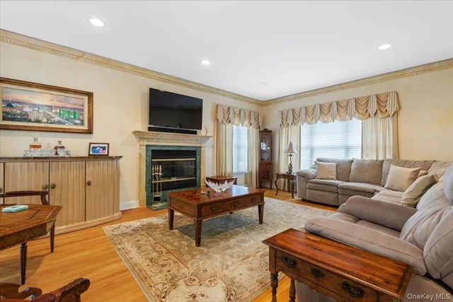 a dining room with furniture and a floor to ceiling window