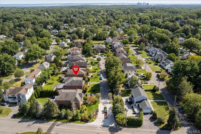 a view of green field with trees in the background