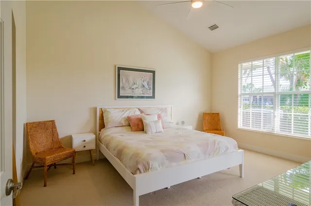 a bedroom with a bed and a chair