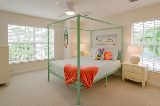 a bedroom with a bed and window