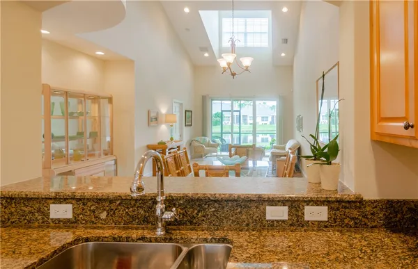 a view of a living room and chandelier